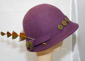 Purple Felt Hat With Cut Feather And Metal Motif On The Hatband